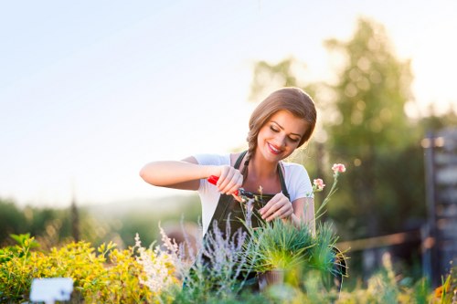 Gardener preparing site with tools and safety gear